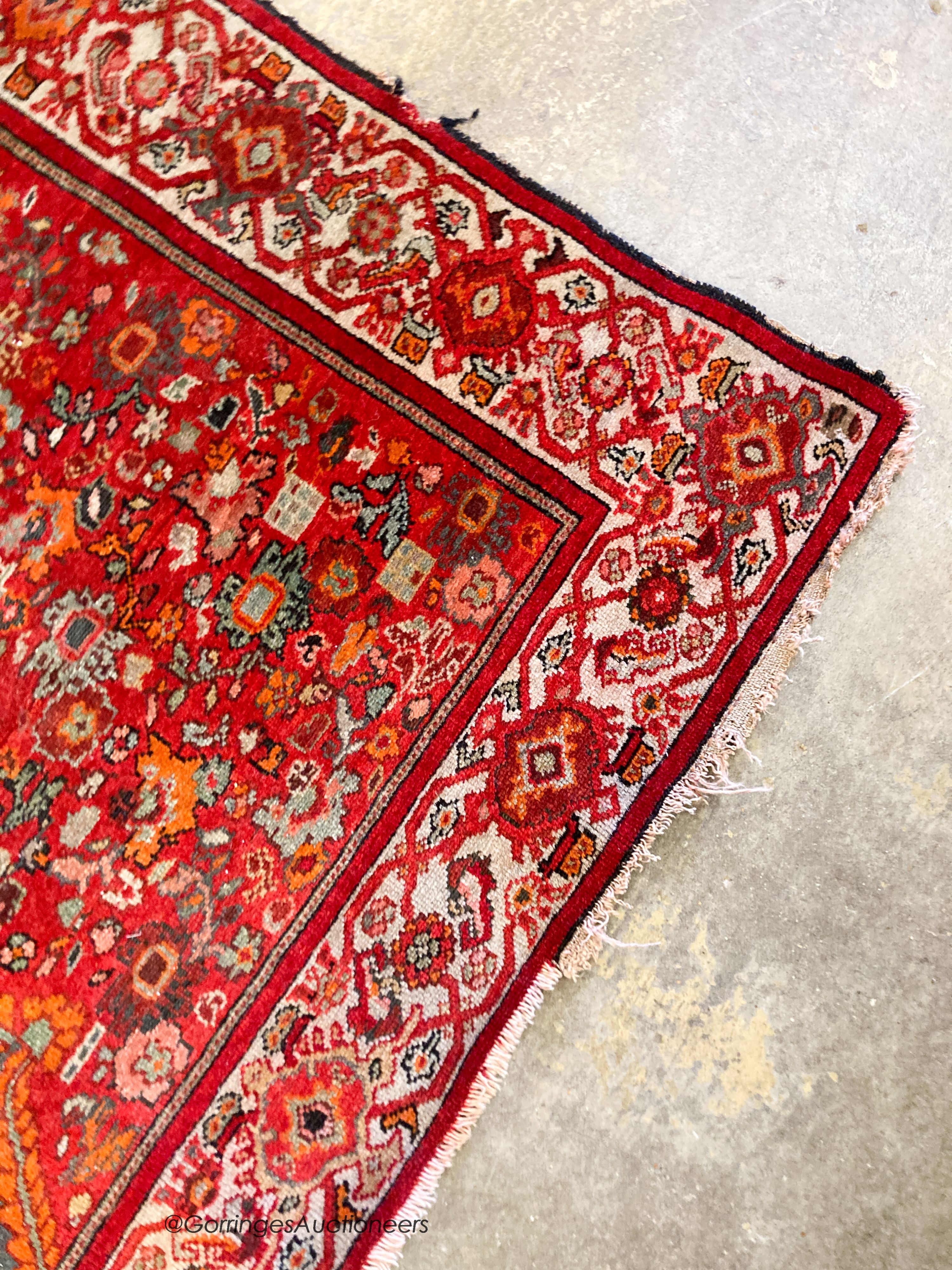 A North West Persain red ground rug, 200 x 132cm